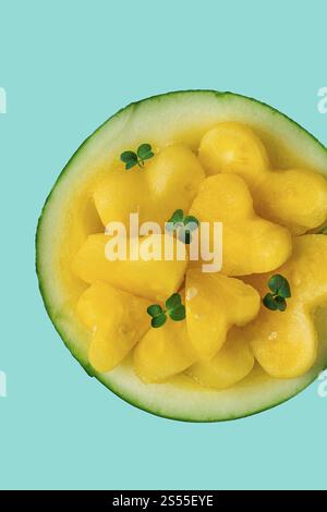 Yellow mini watermelon, Sliced in the shape of a heart, top view, no people, close-up, selective focus Stock Photo