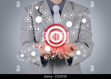 businessman hand shows target symbol as business concept Stock Photo
