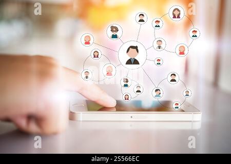 Womans hand touching on communication digital smartphone. Technology with flat people icon on mobile screen. Stock Photo
