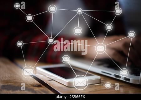 Womans hand work on laptop with email flat icons incoming technology lines in mobile telephone. Communication and technology concept. Stock Photo