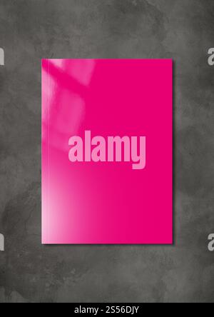 Pink booklet cover isolated on dark concrete background, mockup template. Pink Booklet cover template on dark concrete background Stock Photo