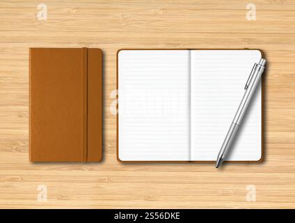 Leather closed and open lined notebooks with a pen. Mockup isolated on wooden background. Leather closed and open lined notebooks with a pen on Stock Photo