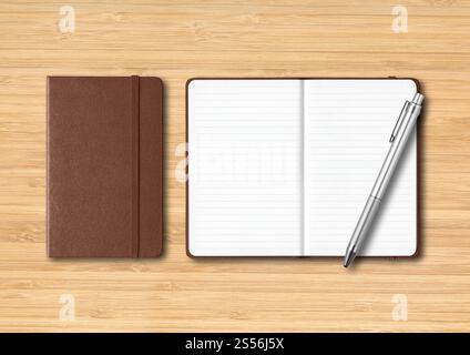 Leather closed and open lined notebooks with a pen. Mockup isolated on wooden background. Leather closed and open lined notebooks with a pen on Stock Photo