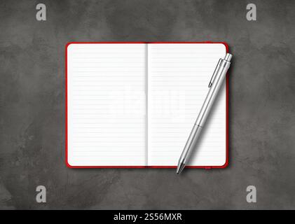 Red open lined notebook mockup with a pen isolated on dark concrete background. Red open lined notebook with a pen isolated on dark concrete Stock Photo