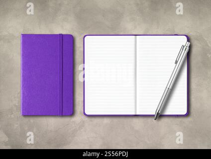 Purple closed and open lined notebooks with a pen . Mockup isolated on concrete background. Purple closed and open lined notebooks with a pen on Stock Photo