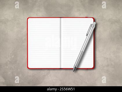 Red open lined notebook mockup with a pen isolated on concrete background. Red open lined notebook with a pen isolated on concrete background Stock Photo