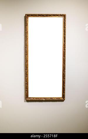 narrow tall picture frame with cutout canvas on gray brown wall Stock Photo