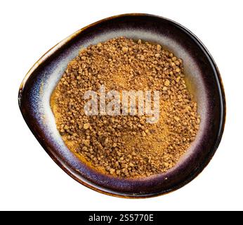 top view of granulated coconut blossom sugar in ceramic bowl isolated on white background Stock Photo