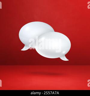 3D white speech bubbles isolated on red square background. White speech bubbles on red square background Stock Photo