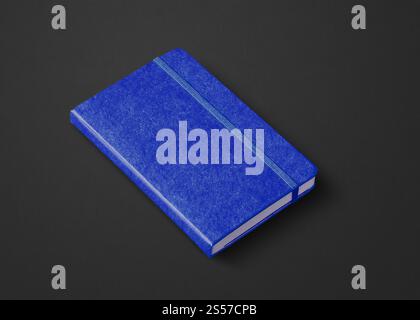 Marine blue closed notebook mockup isolated on black. Marine blue closed notebook isolated on black Stock Photo