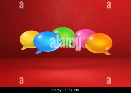 3D multicolor speech bubbles isolated on red background. multicolor speech bubbles on red background Stock Photo