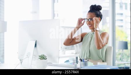 Office, glasses and business woman on computer with frames, prescription lens and spectacles for reading. Entrepreneur, professional and person on pc Stock Photo