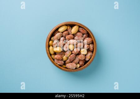 Top view of salted peanuts in wooden bowl Stock Photo