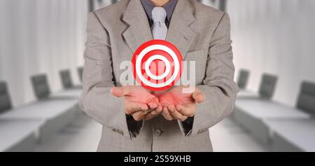 businessman hand shows target symbol as business concept Stock Photo