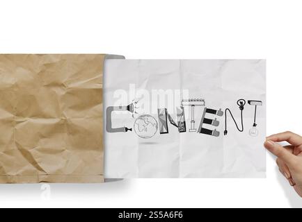 hand pulling crumpled paper from envelope with design word CONTENT as concept Stock Photo