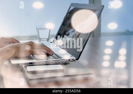 double exposure of business documents on office table with smart phone and digital tablet and stylus and light bulb icon graphic Stock Photo