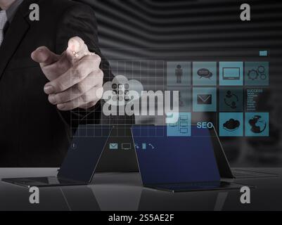 businessman hand working with www. written in search bar on modern computer interface Stock Photo