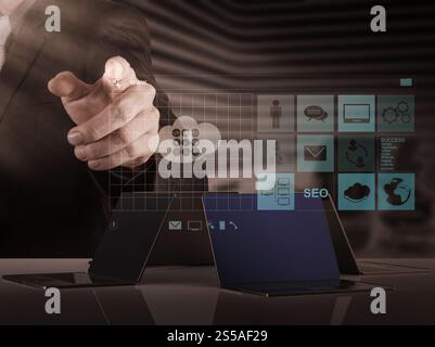 businessman hand working with www. written in search bar on modern computer interface Stock Photo