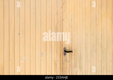 warehouse door made of corrugated metal painted brown Stock Photo