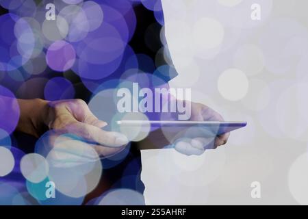Double exposure of businessman hand using Tablet computer with colour cloud concept Stock Photo