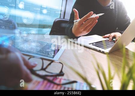 Photo website graphic designer hand meeting team with new project modern studio.Modern laptop digital tablet smart phone on marble table.pan-tone Stock Photo