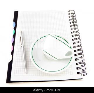 Newspaper with notebook and cup of coffee on table Stock Photo - Alamy