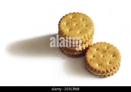 Classic round golden yellow salted cracker isolated on over white background Stock Photo