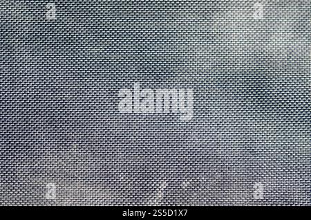 closeup of texture breathable mesh fabric in the black photo backpack. Texture of Black Plastic Weave Bag. Background image Stock Photo