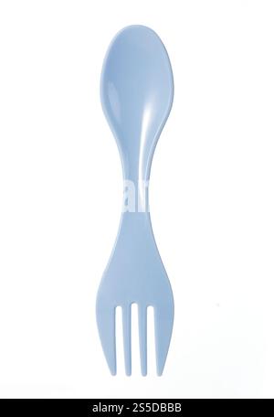 Blue plastic spork combining a spoon and fork in one utensil,isolated on a white background. for camping or outdoor use Stock Photo