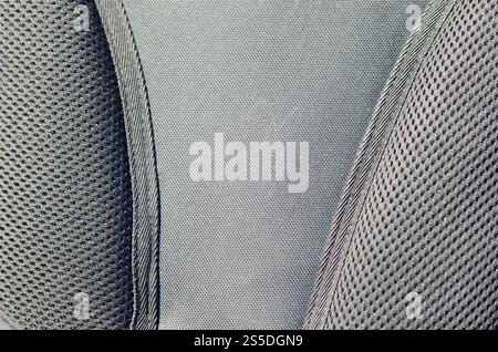 closeup of texture breathable mesh fabric in the black photo backpack. Texture of Black Plastic Weave Bag. Background image Stock Photo