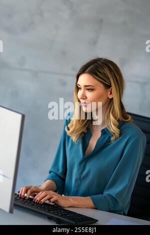 Happy professional business woman company employee, young entrepreneur smiling businesswoman working Stock Photo