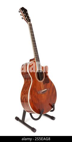 acoustic guitar on stand holder path isolated on white Stock Photo