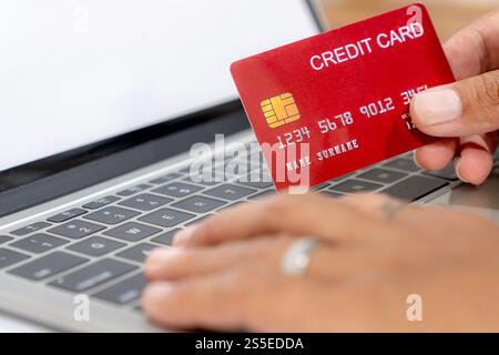 A man holding credit card payment online. Stock Photo