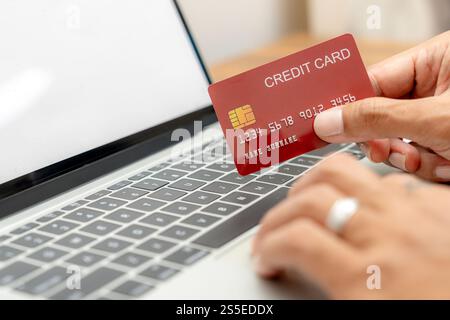 A man holding credit card payment online. Stock Photo