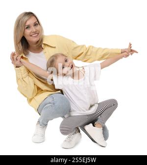 Happy mother and her cute little daughter on white background Stock Photo