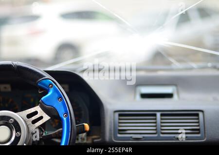 Interior of a car during a traffic accident. View through the drivers eyes in the car with a broken windshield. The concept of inattentive and sloppy Stock Photo