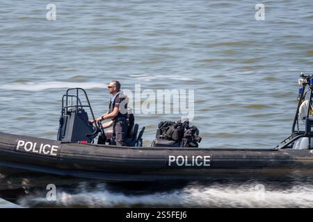 Police patrolling the River Mersey on a rigid inflatable boat. Stock Photo