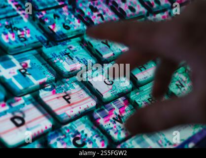 AI technology Landscape, Man typing at laptop with the computer hardware revealed underneath Stock Photo