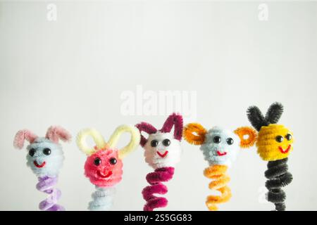 pipe cleaner finger puppets with colorful and bulging eyes, crafts for kids Stock Photo