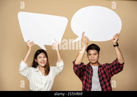 Men and women wearing shirts and hold a thought box symbol. Stock Photo