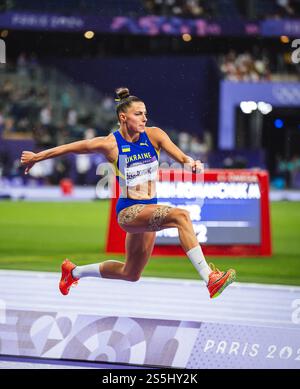 Maryna BEKH-ROMANCHUK participating in the Triple Jump at the Paris 2024 Olympic Games. Stock Photo