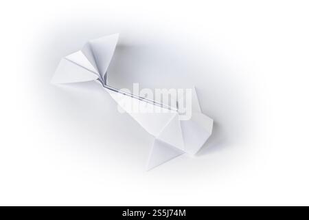 Paper fish origami isolated on a blank white background. Paper fish origami isolated on a white background Stock Photo