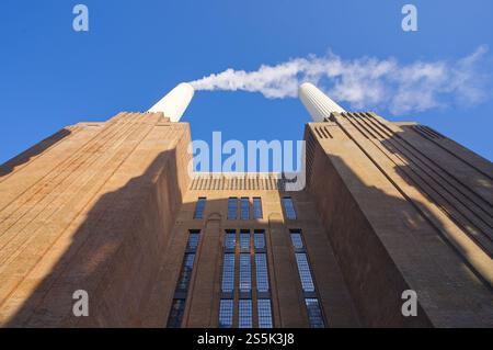 Battersea Power Station on a cold sunny day with blue skies with white smoke coming out of chimney. London - 11th January 2025 Stock Photo