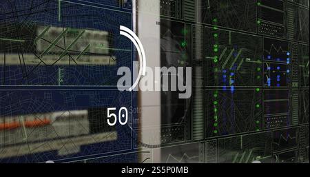 Processing data and analyzing graphs and maps on multiple screens Stock Photo