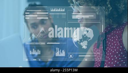 Image of processing data interface over diverse colleagues at laptop in office Stock Photo