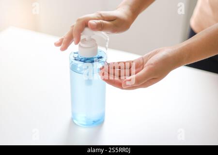 Hand applying Alcohol gel sanitazer liquid cleaning hands for prevent corona virus covid-19 Stock Photo