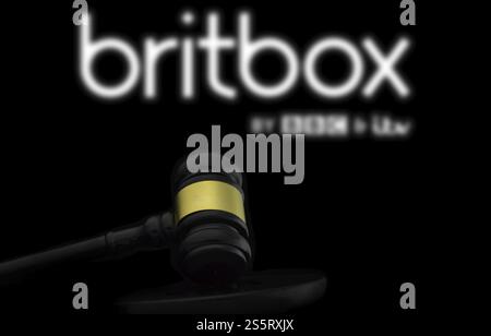 Court gavel in front of the Britbox logo. BritBox is an online digital video streaming subscription service Stock Photo