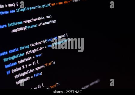 Macro shot of the command line on the monitor of the office computer. The concept of the programmers work. Information line flow Stock Photo