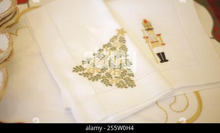 beautiful white cloth napkins with christmas decoration on christmas table for sharing. christmas celebration time concept Stock Photo