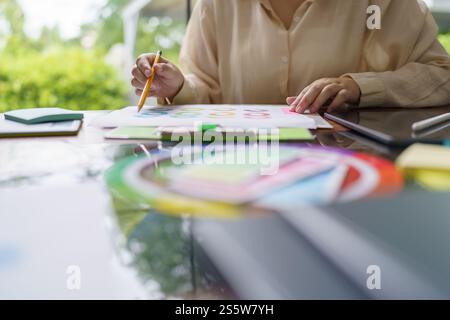 Creative idea Business female Artist Creative Designer sketch graphic drawing on graphic tablet and Color swatch samples Concept of idea creativity Stock Photo